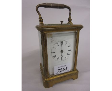 Early 20th Century brass cased carriage clock, the enamel dial with Roman numerals, the two train movement with hour repeat f