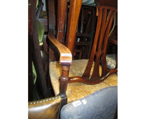 19th Century country elbow chair with a rush seat, together with a 19th Century oak circular pedestal table with tripod base