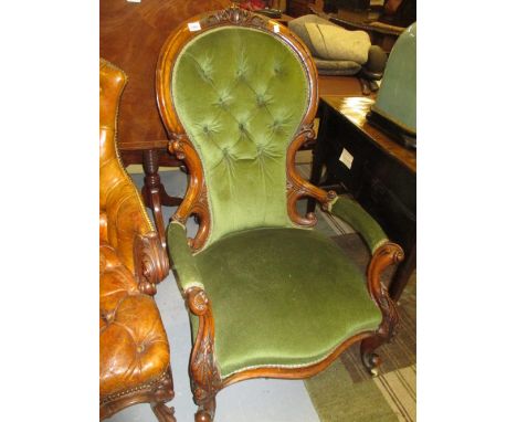 Good quality Victorian carved walnut and button upholstered open armchair with overstuffed seat on carved cabriole front supp