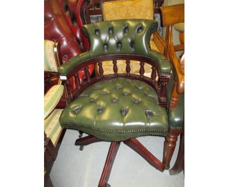 Reproduction button leather upholstered swivel office chair, together with a reproduction two drawer filing cabinet