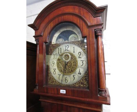 Early 20th Century mahogany longcase clock, the broken arch hood with flanking pilasters and bevelled glass door above a furt