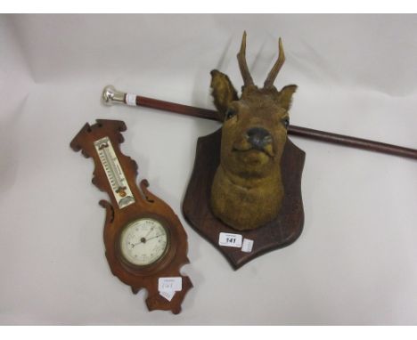 Deer's Head wall trophy, small oak aneroid barometer thermometer and a white metal mounted walking stick