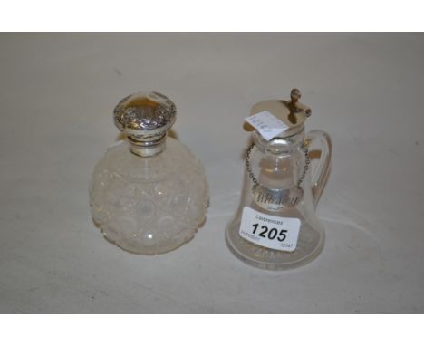 Silver mounted glass whisky decanter and a silver mounted glass perfume bottle