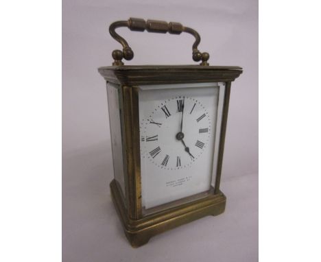 French gilt brass carriage clock, the enamel dial with Roman numerals inscribed Camerer Cuss and Co., New Oxford Street
