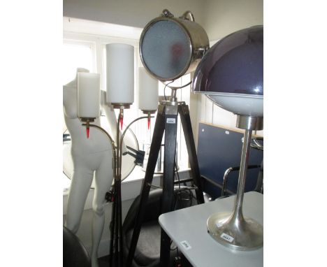 Nickel plated maritime style spot light mounted on an ebonised tripod with nickel plate mounts