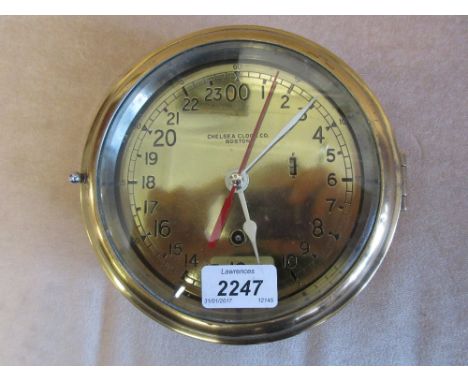 Early to mid 20th Century brass cased ships bulk head clock, the brass dial with Arabic numerals, signed Chelsea Clock Co., B