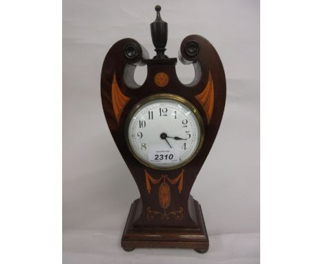 Edwardian mahogany and marquetry inlaid mantel clock of Art Nouveau design, the shaped case with a turned finial surmount, th