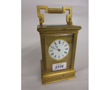 Good quality late 19th or early 20th Century gilt brass cased carriage clock, the plinth and corner pilasters with relief sty