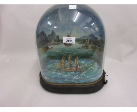 19th Century style musical automaton in the form of a three masted French square rigger under sail, beneath a glass dome with