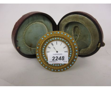 Victorian gilt brass and turquoise mounted circular dressing table clock, the enamel dial with Roman numerals and pocket watc