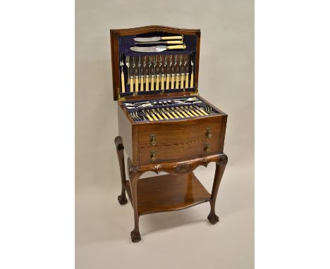 Good quality twelve place setting silver Old English pattern canteen  housed in a mahogany cabinet with hinged lid above two 