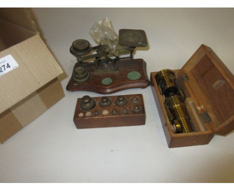 Cased student's microscope, pair of postal scales and another part set of weights
