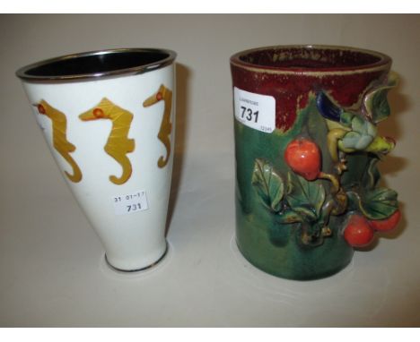 Chinese stoneware brush pot decorated with bird and fruits in relief on a red and green ground, together with an enamel vase 