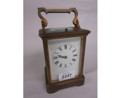 Late 19th or early 20th Century brass cased carriage clock, the enamel dial with Roman numerals, the two train movement with 