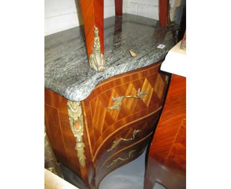 Early 20th Century Continental bombe commode, the marble top above three parquetry decorated drawers with gilt brass floral h