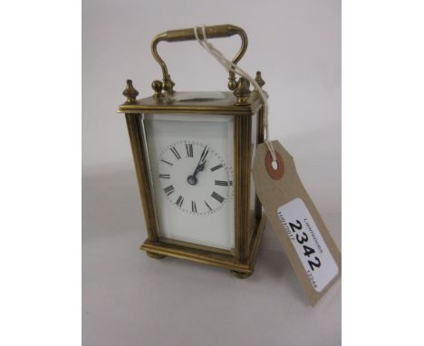 Miniature brass cased carriage clock with fluted corner pilasters, enamel dial, Roman numerals and single train movement