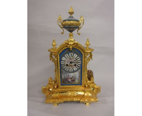 Good quality 19th Century French ormolu and porcelain mounted mantel clock, the urn surmount above an ornate case, the centra