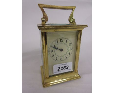 Early 20th Century gilt brass carriage clock, the painted enamel dial with Arabic numerals, the movement inscribed R & Compan