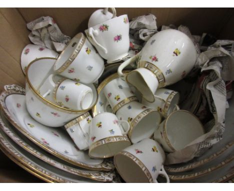 Early 20th Century English porcelain tea service decorated with floral sprigs within a gilt border