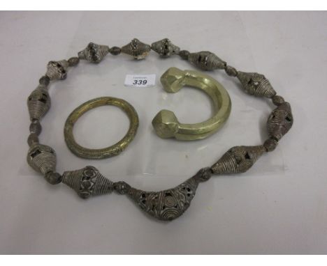 Bronze currency bangle, similar bangle and a Tibetan metal necklace