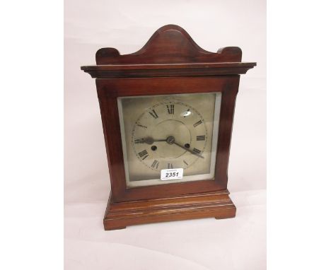 Mahogany cased two train mantel clock with silvered dial and Roman numerals