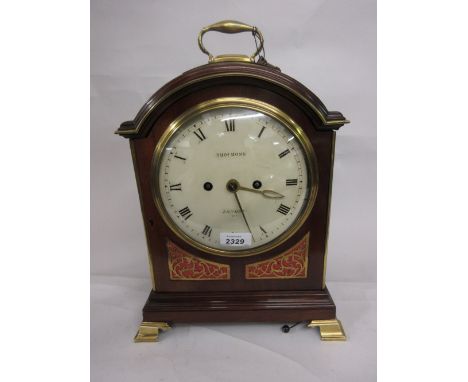 George III mahogany and gilt brass mounted bracket clock, the broken arch case with loop carrying handle and ogee feet, the f