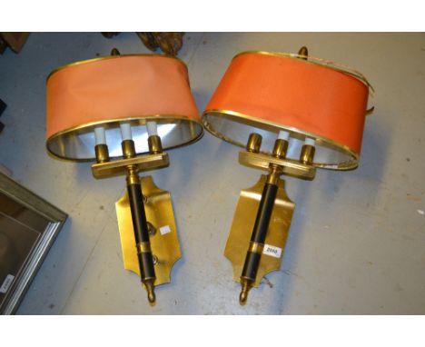 Pair of reproduction brass and black enamel decorated wall lights with oval shades