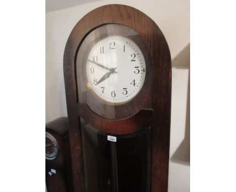 Early 20th Century oak longcase clock having three train weight driven movement with pendulum window and circular silvered di