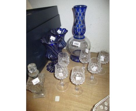 Pair of blue overlaid cut glass goblets with matching carafe, a cut glass decanter with six glasses and a cut glass silver co