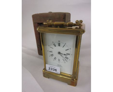 Late 19th or early 20th Century brass cased carriage clock, the enamel dial with Arabic and Roman numerals, signed Greaves, N