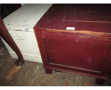 White painted pine trunk with hinged cover together with a painted oak trunk on stile end supports
