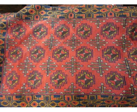 Small Belouch style rug with an all-over gol design on a wine ground with borders, 4ft 6ins x 2ft 10ins approximately