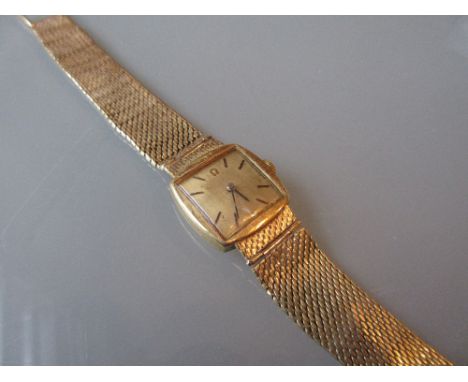 Ladies Omega wristwatch in an 18ct gold case with integral woven strap