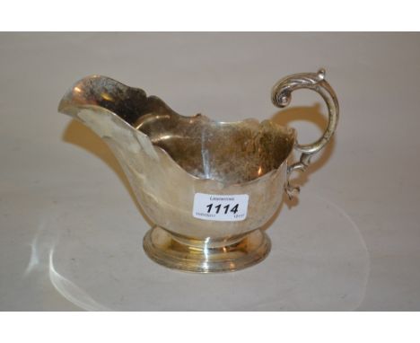 Victorian silver sauce boat in 18th Century style with scroll handle by Hunt and Roskell, late Storr and Mortimer