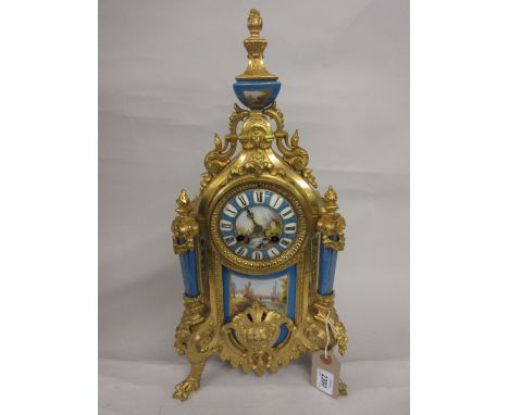 19th Century French gilded spelter and porcelain mounted mantel clock, the urn surmount above a swag and mask head decorated 