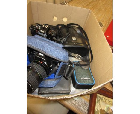 Two Pentax 35mm cameras and a cased pair of binoculars together with a small pair of boxed balance scales