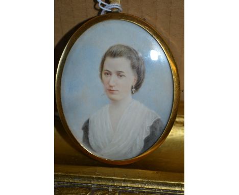 Oval miniature watercolour head and shoulder portrait of a lady wearing a lace shawl, gilt framed