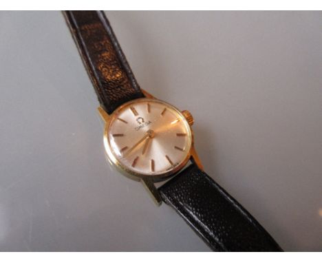 Ladies Omega 9ct gold cased wristwatch on a black leather strap