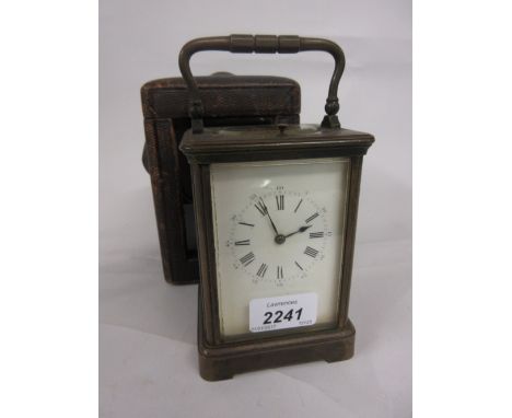 Large 19th Century brass cased repeater carriage clock, having white enamel dial with Roman numerals in original leather trav