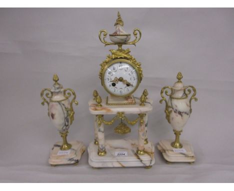 Late 19th / early 20th Century French pale flecked marble and ormolu mounted portico clock, the enamel dial with Arabic numer