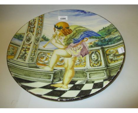 19th Century French Faience Cantagalli type charger painted with Cupid playing a pipe (repaired)