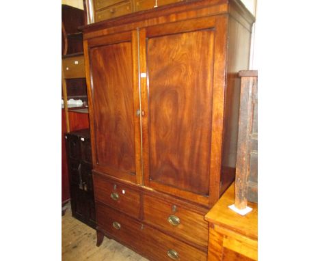 George III mahogany linen press, the moulded cornice above a pair of rectangular panel doors enclosing sliding trays, the bas
