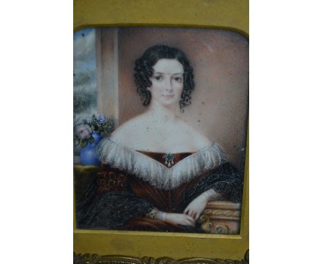 19th Century miniature watercolour portrait of a lady wearing a lace collar leaning on a pedestal in a gilt metal and velvet 
