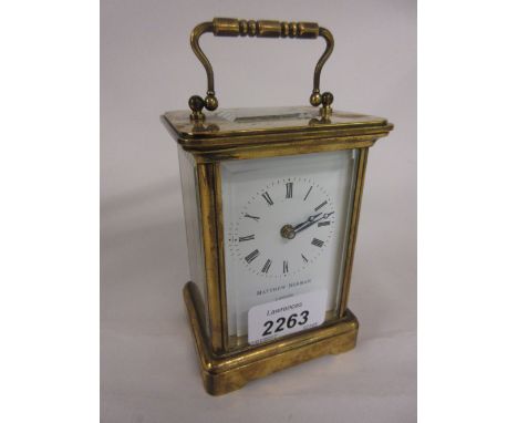 20th Century Swiss gilt brass carriage clock, the enamel dial with Roman numerals inscribed Matthew Norman, London