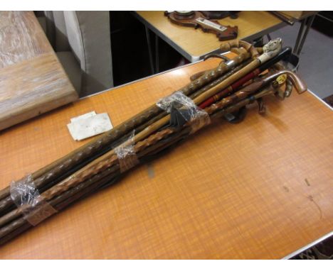 Large collection of various walking sticks including a hoof handled walking stick, silver collared walking stick etc.