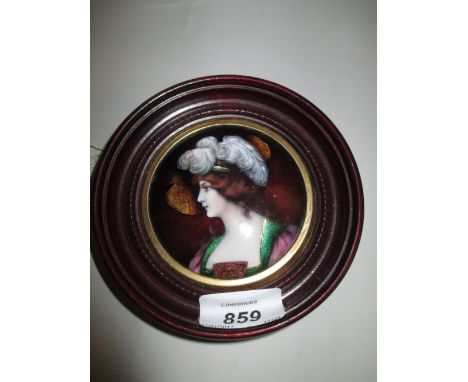 Limoges type circular enamel plaque of a lady wearing an ostrich feather headdress, 3.25ins diameter in a mahogany frame