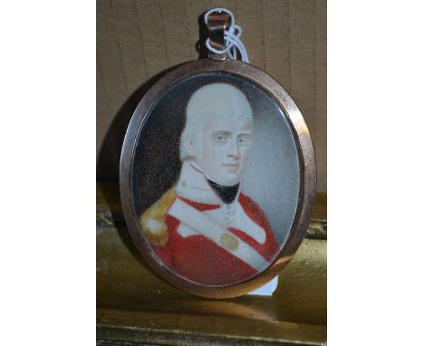 George III oval miniature portrait of a military officer in red tunic, the reverse with hair inset monogrammed panel