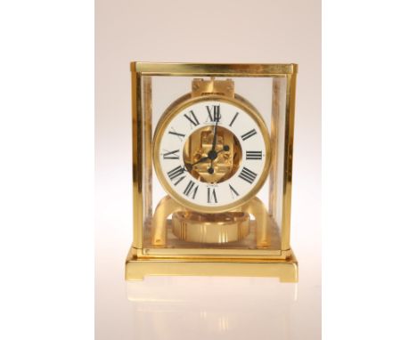 A JAEGER LECOULTRE ATMOS CLOCK, no. 518533, of classic design in a brass four pillar case, without outer case. 22.5cm high, 1