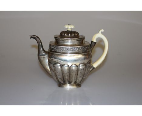 A 19TH CENTURY RUSSIAN SILVER TEAPOT, Mikail Mikaìlovich Karpinshiì, St. Petersburg 1830, with ivory scrolling handle and car