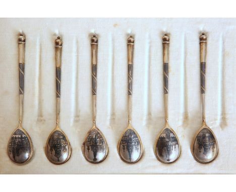 A SET OF SIX RUSSIAN SILVER-GILT AND NIELLO SPOONS, the underside of each bowl decorated with an architectural scene, probabl